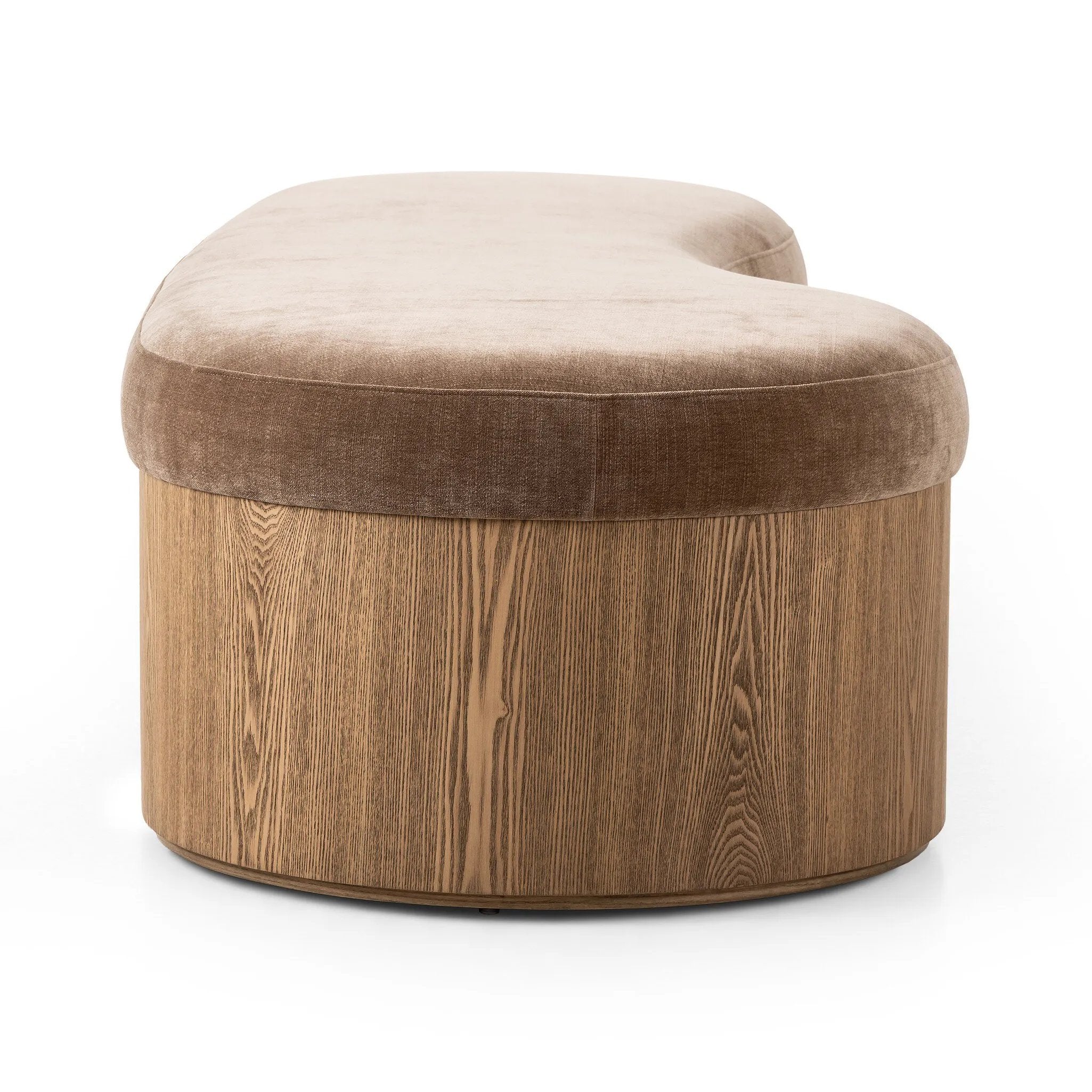 Elevate any room with a curvy statement bench. Made from a kidney-shaped base of toasted ash veneer and a soft, velvety seat Amethyst Home provides interior design, new home construction design consulting, vintage area rugs, and lighting in the Winter Garden metro area.