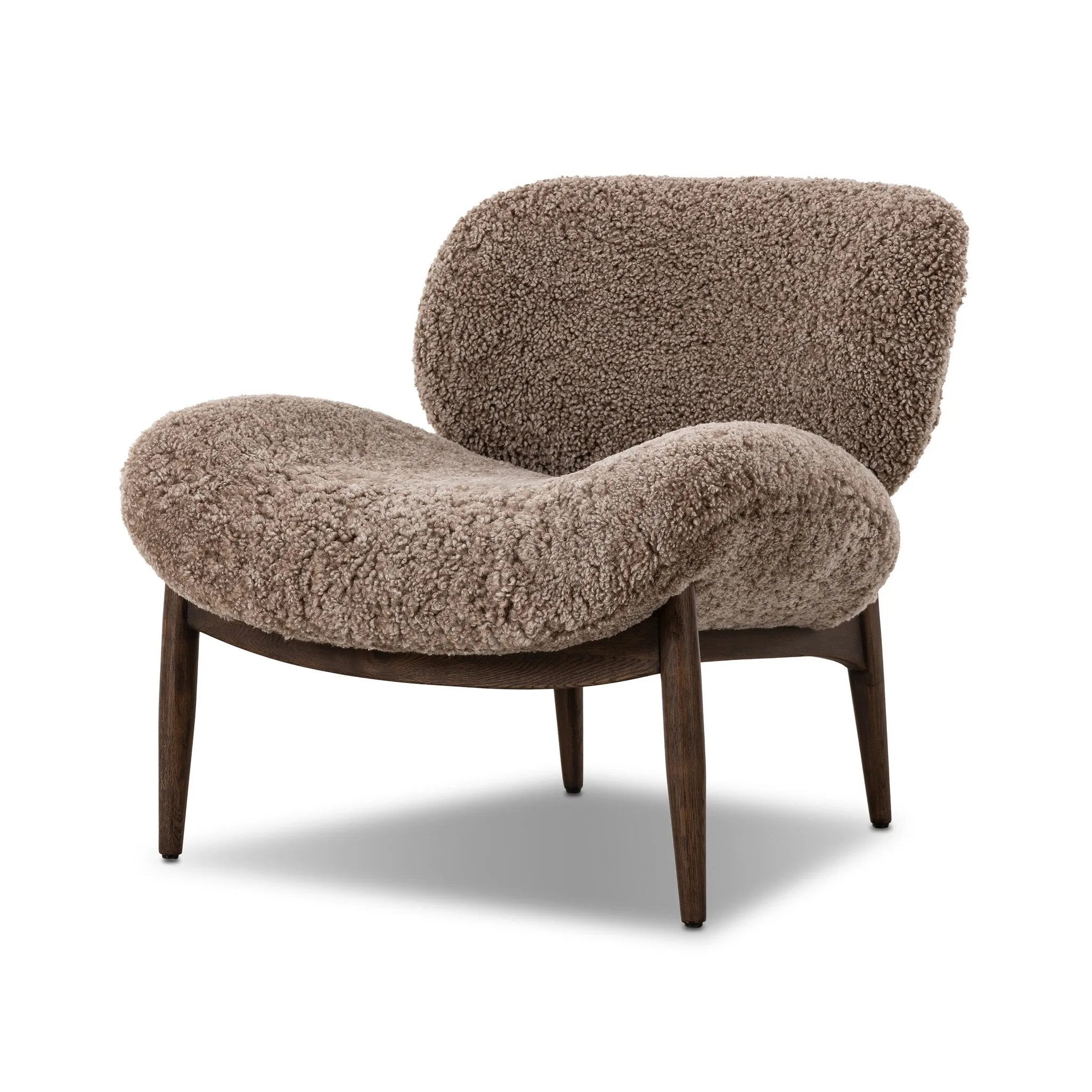 The perfect accent chair, designed for unwinding. Upholstered in a velvety olive chenille made from recycled materials, with wide proportions and cozy curves and cushioning. Slim, tapered wooden legs balance the look Amethyst Home provides interior design, new home construction design consulting, vintage area rugs, and lighting in the Tampa metro area.