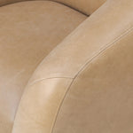 Meet modern comfort. Clean curves, impeccable tailoring and taupe top-grain leather with a pronounced grain bring an elevated, European-inspired look to this swivel chair Amethyst Home provides interior design, new home construction design consulting, vintage area rugs, and lighting in the Omaha metro area.