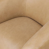 Meet modern comfort. Clean curves, impeccable tailoring and taupe top-grain leather with a pronounced grain bring an elevated, European-inspired look to this swivel chair Amethyst Home provides interior design, new home construction design consulting, vintage area rugs, and lighting in the Washington metro area.
