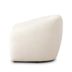 Inspired by French modernism with a nod to Jean Royere's design classic, the Polaire. Our take is defined by exaggerated curves, tapered arms and oversized welt detailing along the reversible seat cushion for a tailored look, finished with a 360-degree swivel. Amethyst Home provides interior design, new home construction design consulting, vintage area rugs, and lighting in the Portland metro area.