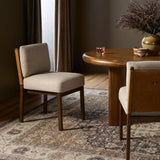 Featuring Chappel Alcala Taupe Dining Chair by Four Hands at Amethyst Home. Elevate your dining space with a mixed-material dining chair of solid oak, top-grain leather and high-performance fabric. On the back, small iron detailing completes the look. Overall Dimensions: 21.00"w x 26.00"d x 33.00"h. Amethyst Home provides interior design, new home construction design consulting, vintage area rugs, and lighting in the Omaha metro area.
