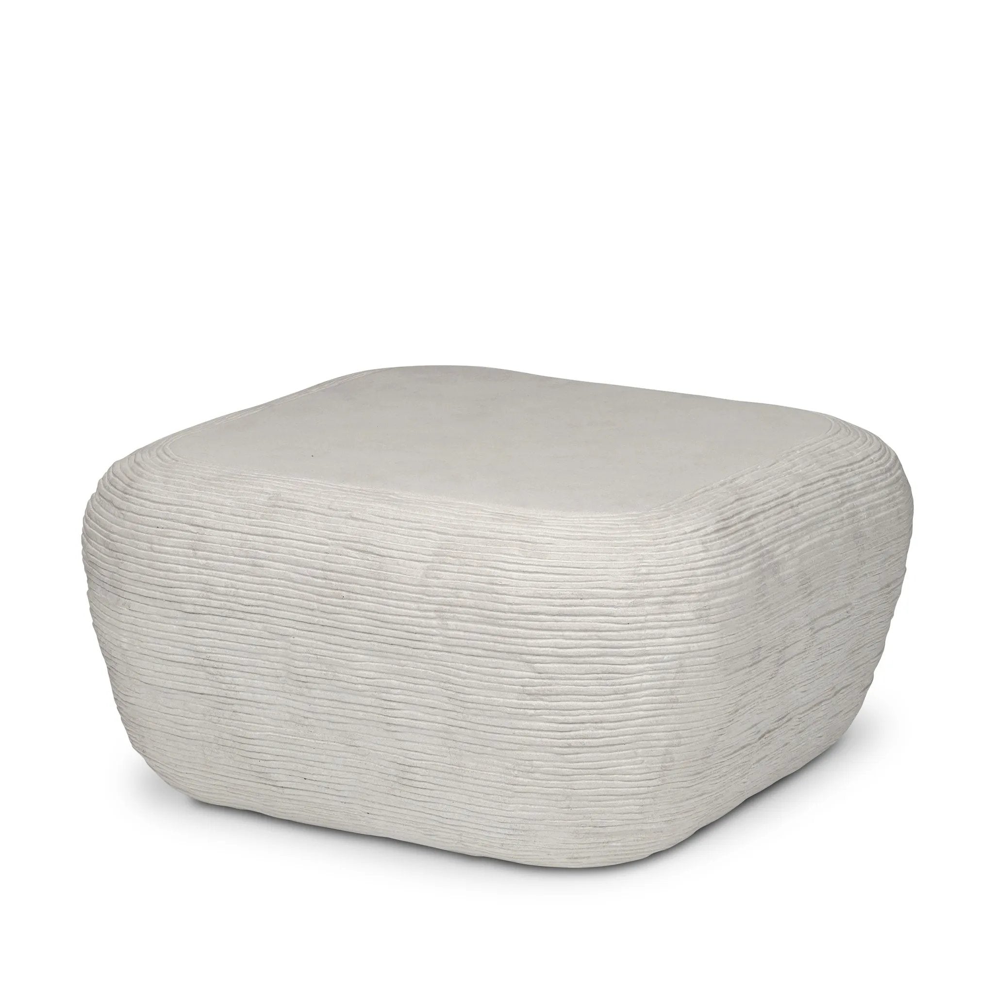 Smooth concrete is etched with a linear pattern, bringing an organic look with texture to this block-style coffee table Amethyst Home provides interior design, new home construction design consulting, vintage area rugs, and lighting in the Boston metro area.