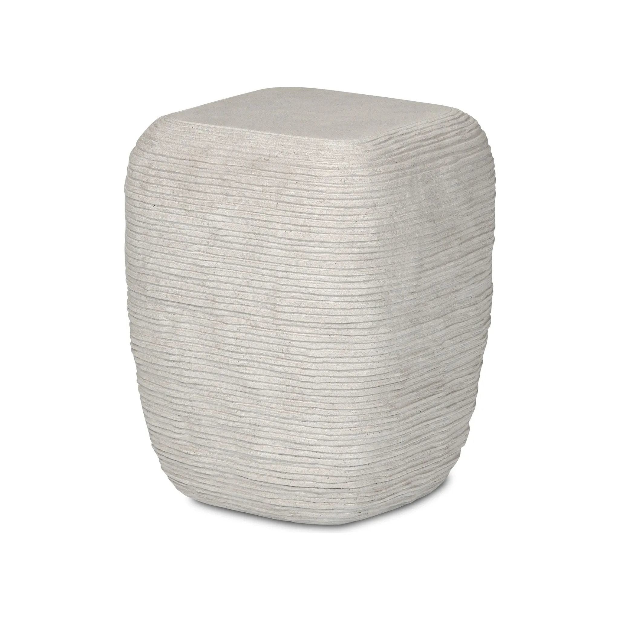 Smooth concrete is etched with a linear pattern, bringing an organic look with texture to this block-style end table Amethyst Home provides interior design, new home construction design consulting, vintage area rugs, and lighting in the Boston metro area.