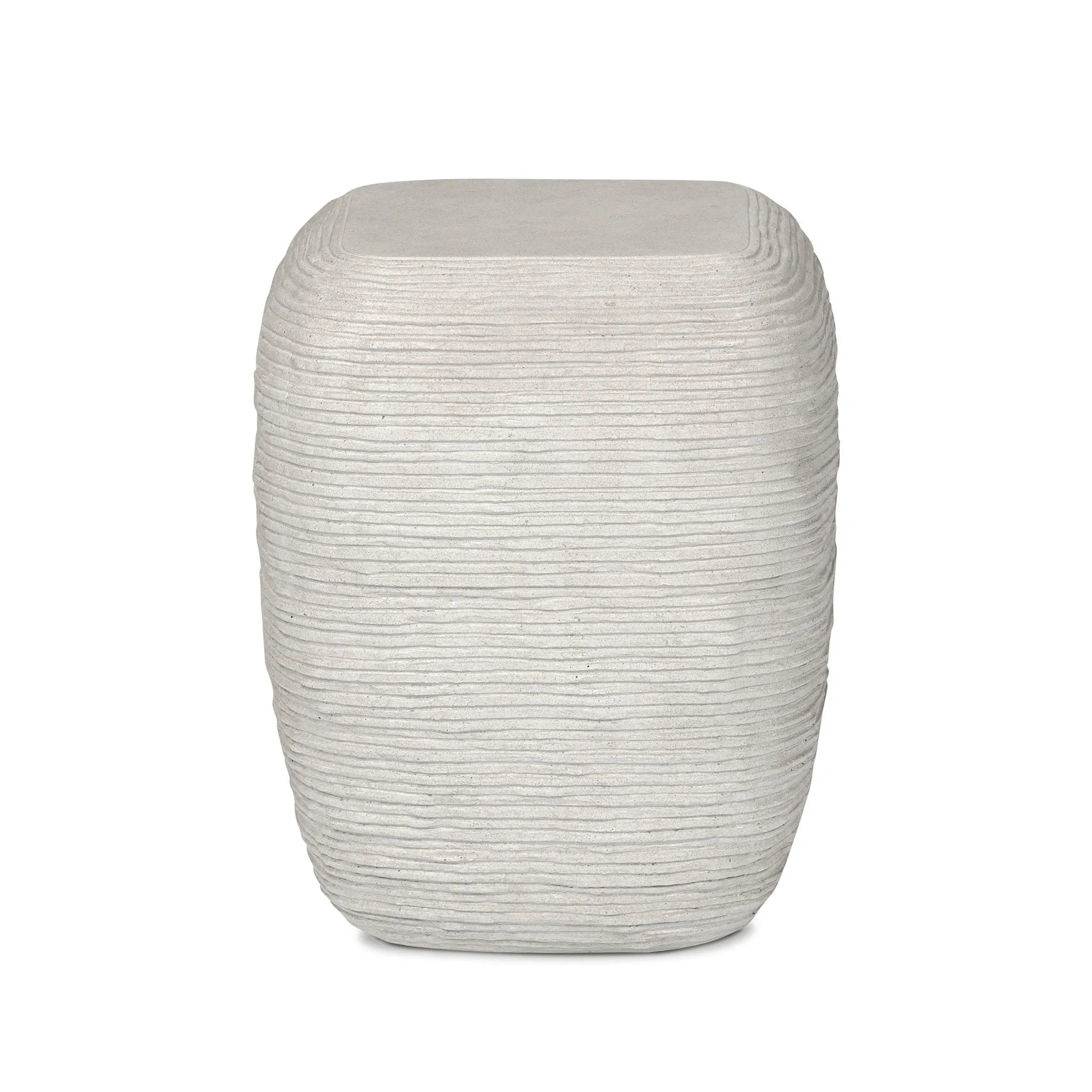 Smooth concrete is etched with a linear pattern, bringing an organic look with texture to this block-style end table Amethyst Home provides interior design, new home construction design consulting, vintage area rugs, and lighting in the Los Angeles metro area.