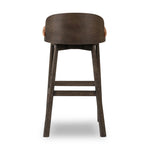 Featuring Cloris Altair Sienna Swivel Bar + Counter Stool by Four Hands at Amethyst Home. Channel vintage vibes with a swivel stool perfectly sized for the bar. Crafted of dark-finished oak, a low, molded back adds a playful touch, while an upholstered seat offers comfort and color. Finished off with a memory swivel to ensure the stool's curved wood bac. Amethyst Home provides interior design, new home construction design consulting, vintage area rugs, and lighting in the Newport Beach metro area.