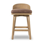 Featuring Cloris Palermo Cigar Swivel Bar + Counter Stool by Four Hands at Amethyst Home. Channel vintage vibes with a swivel stool perfectly sized for the bar. Crafted of blonde-finished oak, a low, molded back adds a playful touch, while a top-grain leather seat offers luxe comfort. Finished off with a memory swivel to ensure the stool's curved wood back sta. Amethyst Home provides interior design, new home construction design consulting, vintage area rugs, and lighting in the Boston metro area.