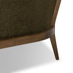 A Swedish Gustavian inspired captain chair gets a modern update with high arms and an exposed frame. The tight cushion in olive fabric paired with buff parawood lends a luxe natural feel Amethyst Home provides interior design, new home construction design consulting, vintage area rugs, and lighting in the Omaha metro area.