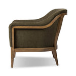 A Swedish Gustavian inspired captain chair gets a modern update with high arms and an exposed frame. The tight cushion in olive fabric paired with buff parawood lends a luxe natural feel Amethyst Home provides interior design, new home construction design consulting, vintage area rugs, and lighting in the Tampa metro area.