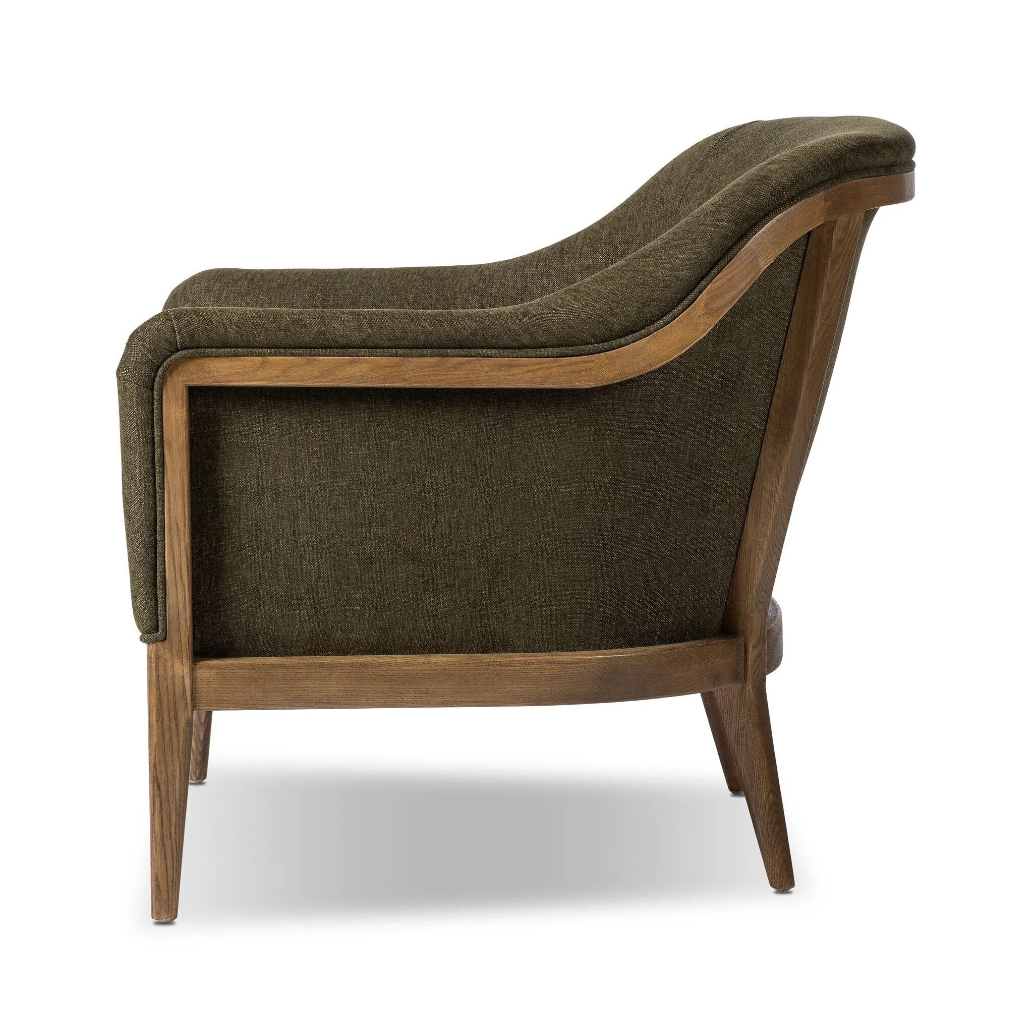 A Swedish Gustavian inspired captain chair gets a modern update with high arms and an exposed frame. The tight cushion in olive fabric paired with buff parawood lends a luxe natural feel Amethyst Home provides interior design, new home construction design consulting, vintage area rugs, and lighting in the Tampa metro area.