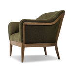 A Swedish Gustavian inspired captain chair gets a modern update with high arms and an exposed frame. The tight cushion in olive fabric paired with buff parawood lends a luxe natural feel Amethyst Home provides interior design, new home construction design consulting, vintage area rugs, and lighting in the Winter Garden metro area.