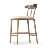 Featuring Colter Antwerp Natural Counter Stool by Four Hands at Amethyst Home. Made from solid ash with an amber finish, this versatile counter stool pairs an airy back with tapered spindles, for a simple, inviting look. A fixed upholstered seat of high-performance fabric adds a smart, comfortable touch. Steam regularly for a crisper fabric look. Performance f. Amethyst Home provides interior design, new home construction design consulting, vintage area rugs, and lighting in the Austin metro area.
