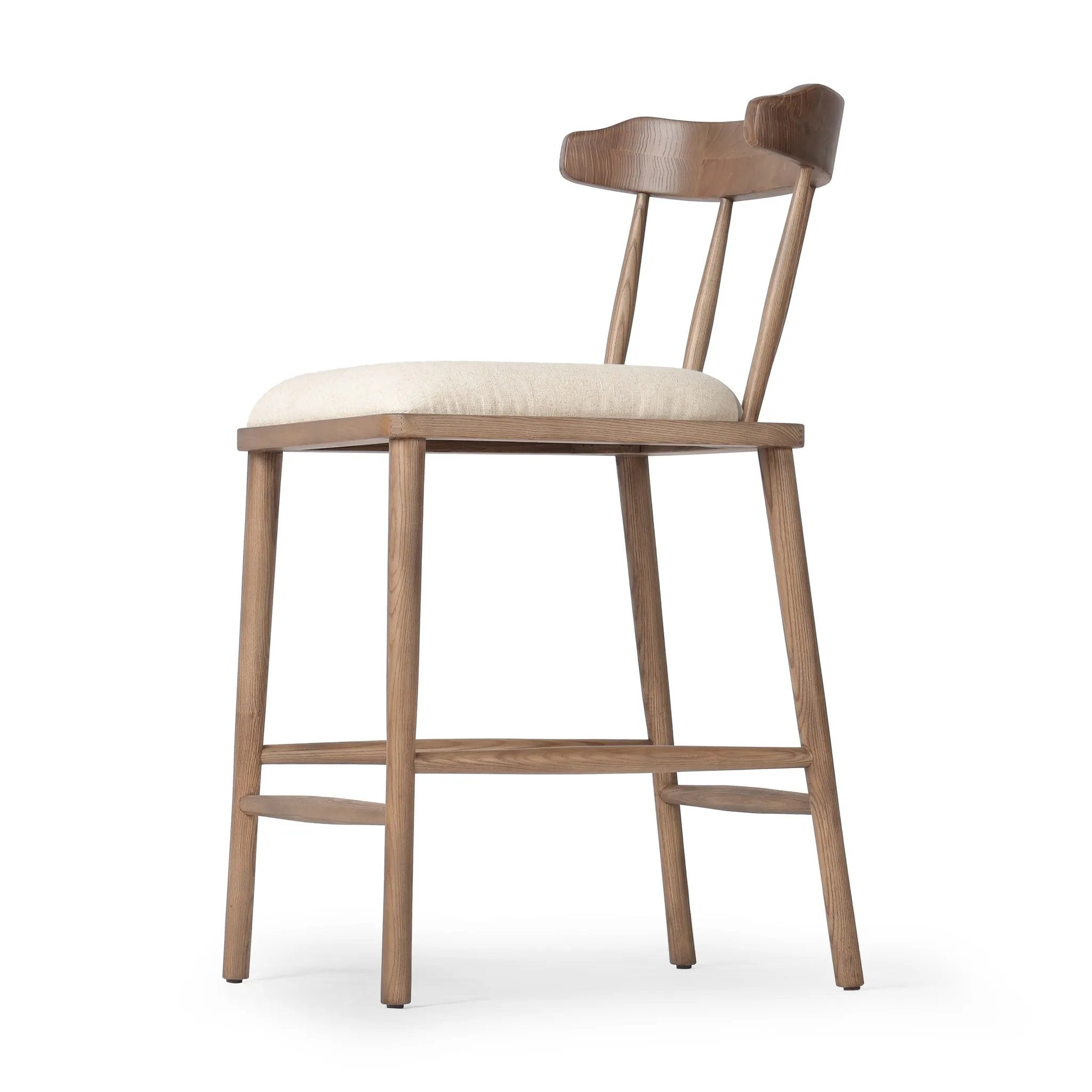 Featuring Colter Antwerp Natural Counter Stool by Four Hands at Amethyst Home. Made from solid ash with an amber finish, this versatile counter stool pairs an airy back with tapered spindles, for a simple, inviting look. A fixed upholstered seat of high-performance fabric adds a smart, comfortable touch. Steam regularly for a crisper fabric look. Performance f. Amethyst Home provides interior design, new home construction design consulting, vintage area rugs, and lighting in the Austin metro area.