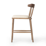 Featuring Colter Antwerp Natural Counter Stool by Four Hands at Amethyst Home. Made from solid ash with an amber finish, this versatile counter stool pairs an airy back with tapered spindles, for a simple, inviting look. A fixed upholstered seat of high-performance fabric adds a smart, comfortable touch. Steam regularly for a crisper fabric look. Perfor. Amethyst Home provides interior design, new home construction design consulting, vintage area rugs, and lighting in the Winter Garden metro area.