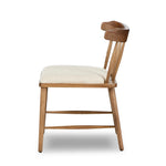Featuring Colter Antwerp Natural Dining Chair by Four Hands at Amethyst Home. Made from solid ash with an amber finish, this versatile dining chair pairs an airy back with tapered spindles, for a simple, inviting look. Fixed upholstered seat of high-performance fabric adds a smart, comfortable touch. Performance fabrics are specially created to withstand spill. Amethyst Home provides interior design, new home construction design consulting, vintage area rugs, and lighting in the Boston metro area.