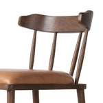 Made from solid ash with a vintage finish, this versatile counter stool pairs an airy back with tapered spindles, for a simple, inviting look. A fixed upholstered seat of top-grain leather adds a smart, comfortable touch Amethyst Home provides interior design, new home construction design consulting, vintage area rugs, and lighting in the Des Moines metro area.