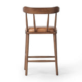 Made from solid ash with a vintage finish, this versatile counter stool pairs an airy back with tapered spindles, for a simple, inviting look. A fixed upholstered seat of top-grain leather adds a smart, comfortable touch Amethyst Home provides interior design, new home construction design consulting, vintage area rugs, and lighting in the Omaha metro area.