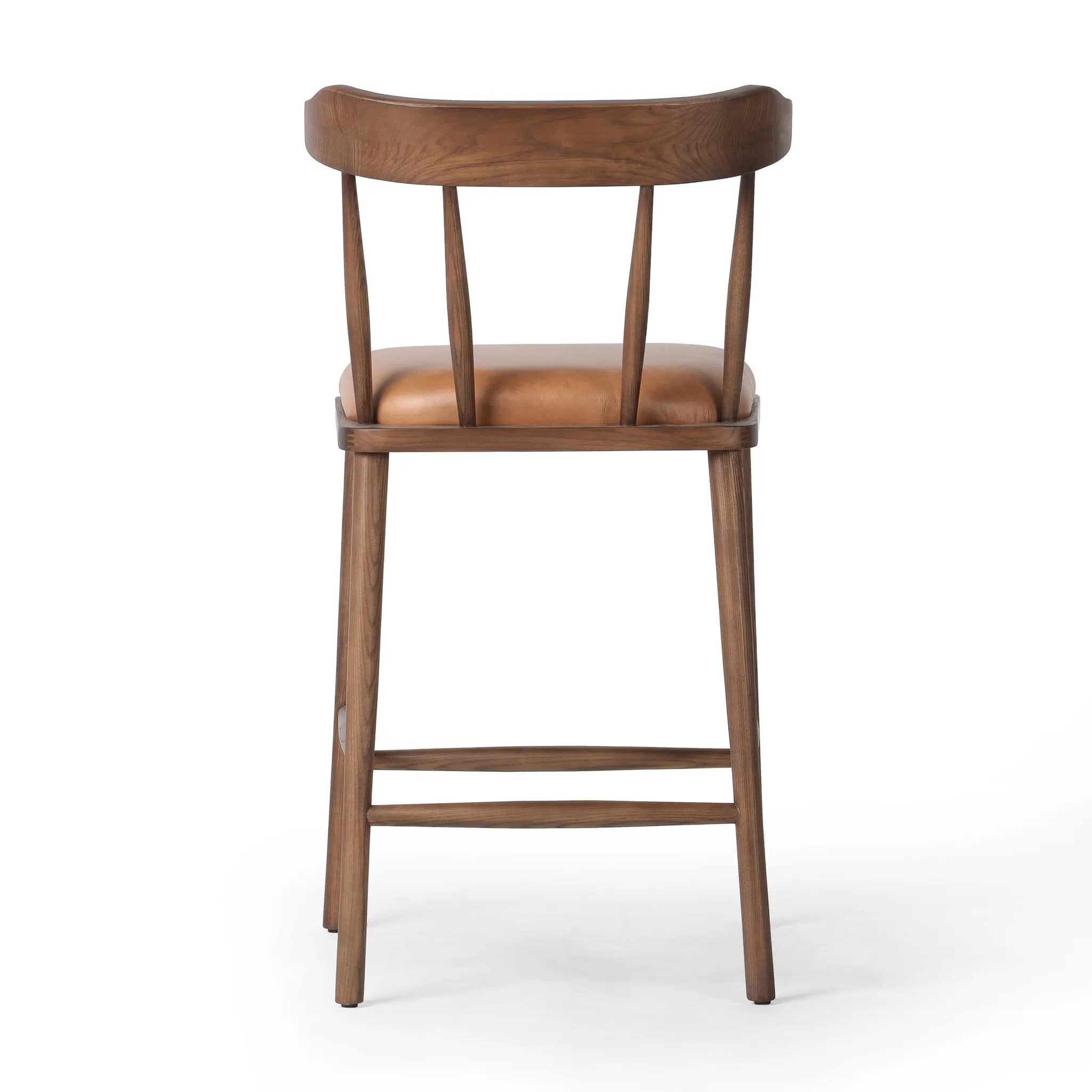 Made from solid ash with a vintage finish, this versatile counter stool pairs an airy back with tapered spindles, for a simple, inviting look. A fixed upholstered seat of top-grain leather adds a smart, comfortable touch Amethyst Home provides interior design, new home construction design consulting, vintage area rugs, and lighting in the Omaha metro area.