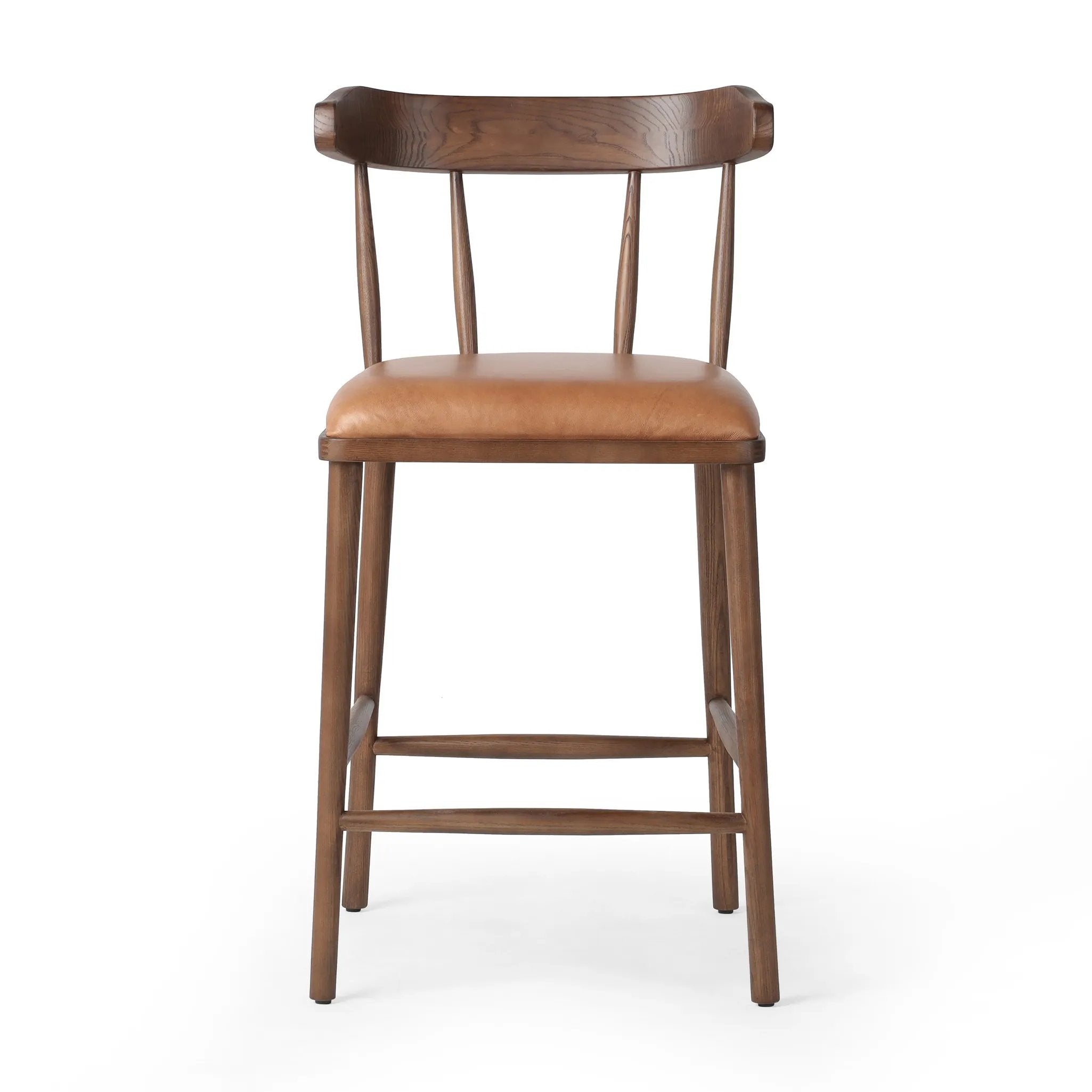 Made from solid ash with a vintage finish, this versatile counter stool pairs an airy back with tapered spindles, for a simple, inviting look. A fixed upholstered seat of top-grain leather adds a smart, comfortable touch Amethyst Home provides interior design, new home construction design consulting, vintage area rugs, and lighting in the Salt Lake City metro area.
