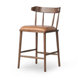 Made from solid ash with a vintage finish, this versatile counter stool pairs an airy back with tapered spindles, for a simple, inviting look. A fixed upholstered seat of top-grain leather adds a smart, comfortable touch Amethyst Home provides interior design, new home construction design consulting, vintage area rugs, and lighting in the Washington metro area.