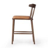 Made from solid ash with a vintage finish, this versatile counter stool pairs an airy back with tapered spindles, for a simple, inviting look. A fixed upholstered seat of top-grain leather adds a smart, comfortable touch Amethyst Home provides interior design, new home construction design consulting, vintage area rugs, and lighting in the Winter Garden metro area.