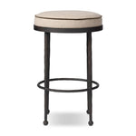 Hammered iron legs with ball-shaped foot details elevate this simply shaped bar stool. A round, cushioned seat upholstered in performance fabric offers a clean, inviting look. Performance fabrics are specially created to withstand spills, stains, high traffic and wear, ensuring long-term comfort and unmatched durability Amethyst Home provides interior design, new home construction design consulting, vintage area rugs, and lighting in the Boston metro area.