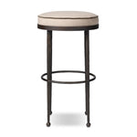 Hammered iron legs with ball-shaped foot details elevate this simply shaped bar stool. A round, cushioned seat upholstered in performance fabric offers a clean, inviting look. Performance fabrics are specially created to withstand spills, stains, high traffic and wear, ensuring long-term comfort and unmatched durability Amethyst Home provides interior design, new home construction design consulting, vintage area rugs, and lighting in the Calabasas metro area.