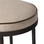 Hammered iron legs with ball-shaped foot details elevate this simply shaped bar stool. A round, cushioned seat upholstered in performance fabric offers a clean, inviting look. Performance fabrics are specially created to withstand spills, stains, high traffic and wear, ensuring long-term comfort and unmatched durability Amethyst Home provides interior design, new home construction design consulting, vintage area rugs, and lighting in the Charlotte metro area.