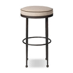 Hammered iron legs with ball-shaped foot details elevate this simply shaped bar stool. A round, cushioned seat upholstered in performance fabric offers a clean, inviting look. Performance fabrics are specially created to withstand spills, stains, high traffic and wear, ensuring long-term comfort and unmatched durability Amethyst Home provides interior design, new home construction design consulting, vintage area rugs, and lighting in the Dallas metro area.