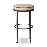Hammered iron legs with ball-shaped foot details elevate this simply shaped bar stool. A round, cushioned seat upholstered in performance fabric offers a clean, inviting look. Performance fabrics are specially created to withstand spills, stains, high traffic and wear, ensuring long-term comfort and unmatched durability Amethyst Home provides interior design, new home construction design consulting, vintage area rugs, and lighting in the Dallas metro area.
