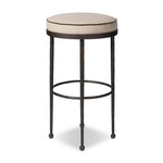 Hammered iron legs with ball-shaped foot details elevate this simply shaped bar stool. A round, cushioned seat upholstered in performance fabric offers a clean, inviting look. Performance fabrics are specially created to withstand spills, stains, high traffic and wear, ensuring long-term comfort and unmatched durability Amethyst Home provides interior design, new home construction design consulting, vintage area rugs, and lighting in the Portland metro area.