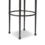 Hammered iron legs with ball-shaped foot details elevate this simply shaped bar stool. A round, cushioned seat upholstered in performance fabric offers a clean, inviting look. Performance fabrics are specially created to withstand spills, stains, high traffic and wear, ensuring long-term comfort and unmatched durability Amethyst Home provides interior design, new home construction design consulting, vintage area rugs, and lighting in the Seattle metro area.