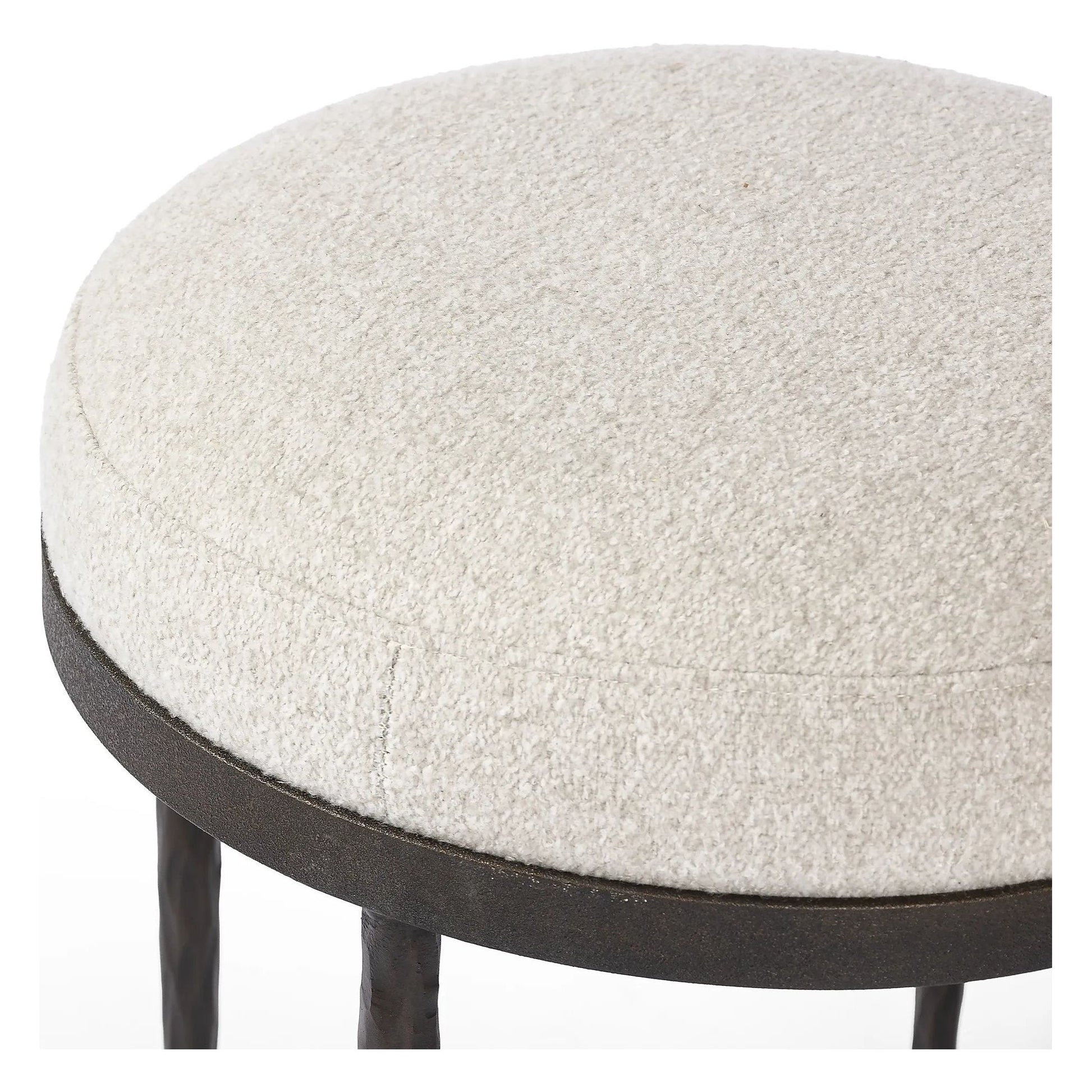 Work midcentury vibes into any space with a pared-back accent stool that doubles as a cocktail ottoman. Wrough iron legs finished in a hammered bronze pair with a simple rounded seat upholstered in a texture-rich fabric, with S-spring suspension for comfort and structure Amethyst Home provides interior design, new home construction design consulting, vintage area rugs, and lighting in the Miami metro area.