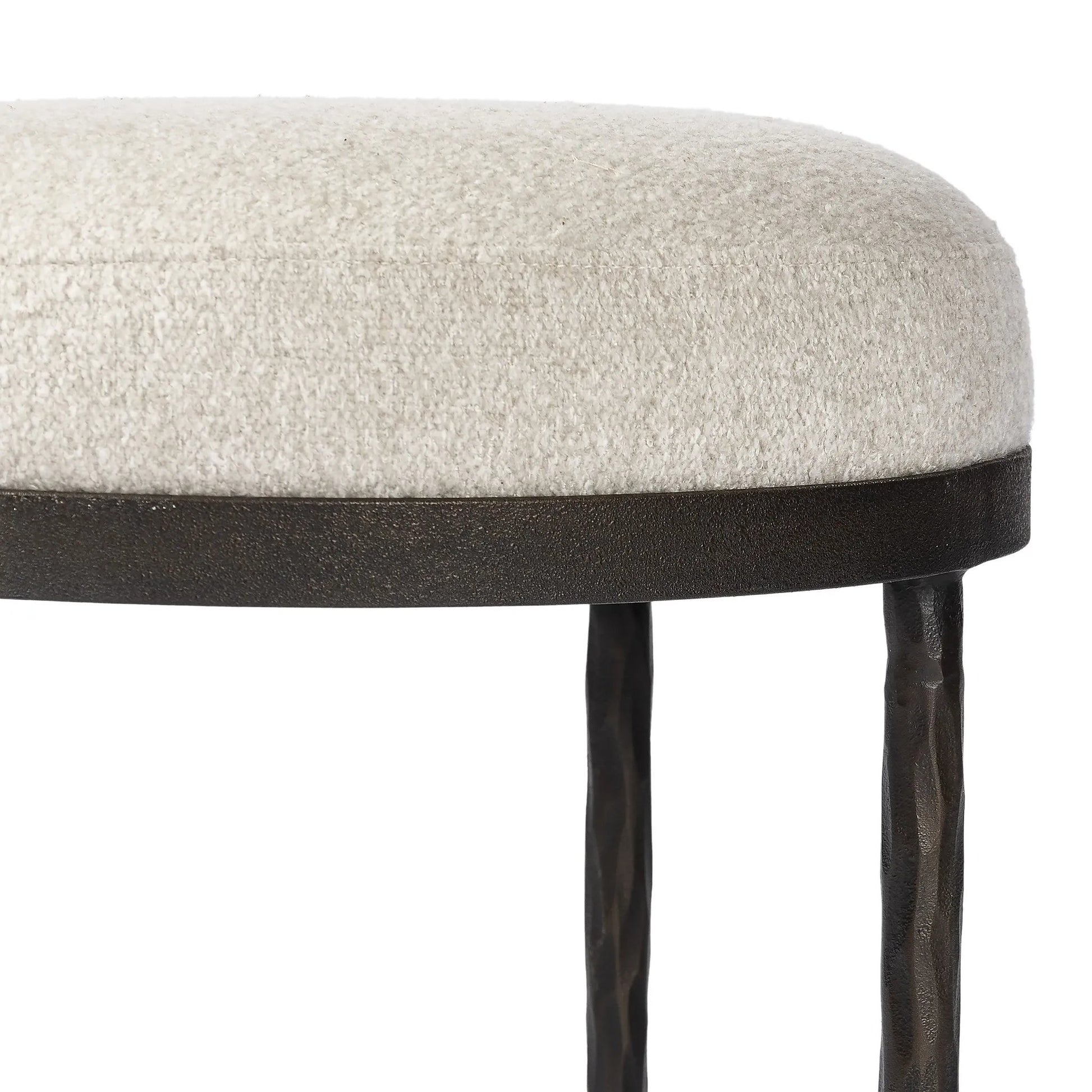 Work midcentury vibes into any space with a pared-back accent stool that doubles as a cocktail ottoman. Wrough iron legs finished in a hammered bronze pair with a simple rounded seat upholstered in a texture-rich fabric, with S-spring suspension for comfort and structure Amethyst Home provides interior design, new home construction design consulting, vintage area rugs, and lighting in the Monterey metro area.