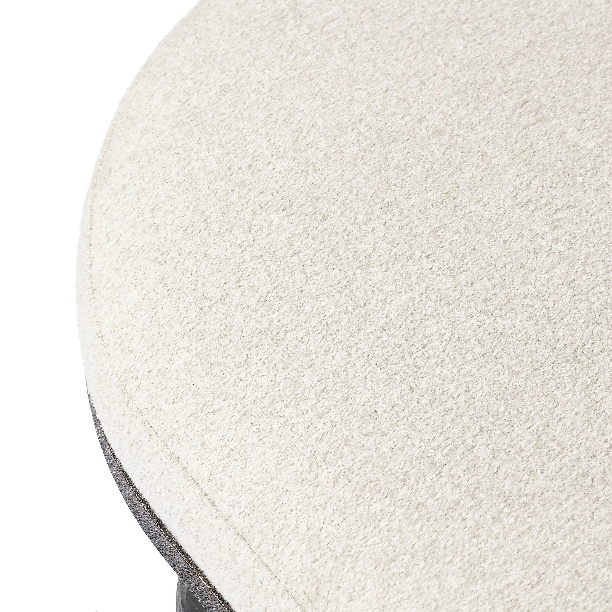 Featuring Corinne Crete Pebble Cocktail Ottoman by Four Hands at Amethyst Home. Place this round ottoman just about anywhere for a subtle retro vibe. Upholstered in a faux Mongolian shearling with a high pile fur. Parawood legs are wirebrushed for a warm, vintage feel.Overall Dimensions: 65.00"w x 35.00"d x 16.00"hWeight : 70.55 lbsMaterials: 100% Harmolan . Amethyst Home provides interior design, new home construction design consulting, vintage area rugs, and lighting in the Charlotte metro area.
