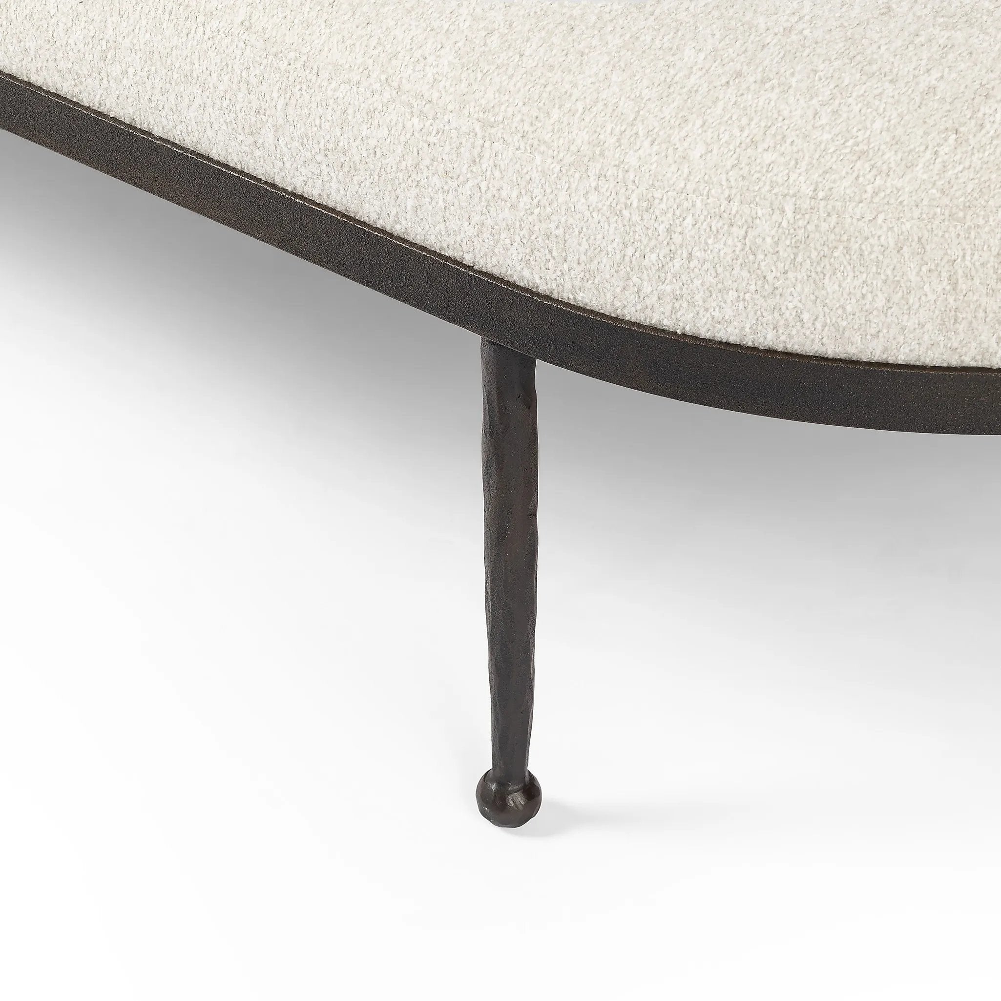 Featuring Corinne Crete Pebble Cocktail Ottoman by Four Hands at Amethyst Home. Place this round ottoman just about anywhere for a subtle retro vibe. Upholstered in a faux Mongolian shearling with a high pile fur. Parawood legs are wirebrushed for a warm, vintage feel.Overall Dimensions: 65.00"w x 35.00"d x 16.00"hWeight : 70.55 lbsMaterials: 100% Harmolan . Amethyst Home provides interior design, new home construction design consulting, vintage area rugs, and lighting in the San Diego metro area.