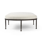 Featuring Corinne Crete Pebble Cocktail Ottoman by Four Hands at Amethyst Home. Place this round ottoman just about anywhere for a subtle retro vibe. Upholstered in a faux Mongolian shearling with a high pile fur. Parawood legs are wirebrushed for a warm, vintage feel.Overall Dimensions: 65.00"w x 35.00"d x 16.00"hWeight : 70.55 lbsMaterials: 100% Harmolan Po. Amethyst Home provides interior design, new home construction design consulting, vintage area rugs, and lighting in the Seattle metro area.