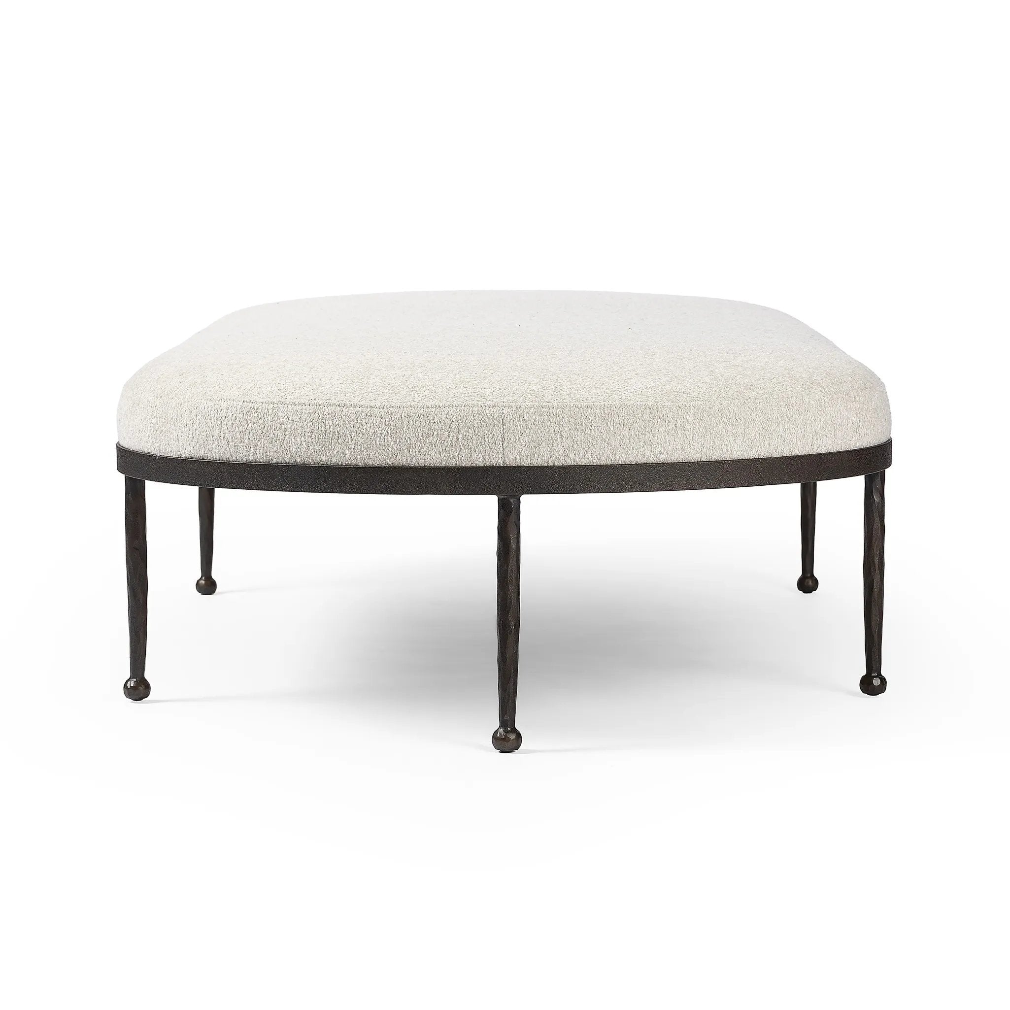 Featuring Corinne Crete Pebble Cocktail Ottoman by Four Hands at Amethyst Home. Place this round ottoman just about anywhere for a subtle retro vibe. Upholstered in a faux Mongolian shearling with a high pile fur. Parawood legs are wirebrushed for a warm, vintage feel.Overall Dimensions: 65.00"w x 35.00"d x 16.00"hWeight : 70.55 lbsMaterials: 100% Harmolan Po. Amethyst Home provides interior design, new home construction design consulting, vintage area rugs, and lighting in the Seattle metro area.