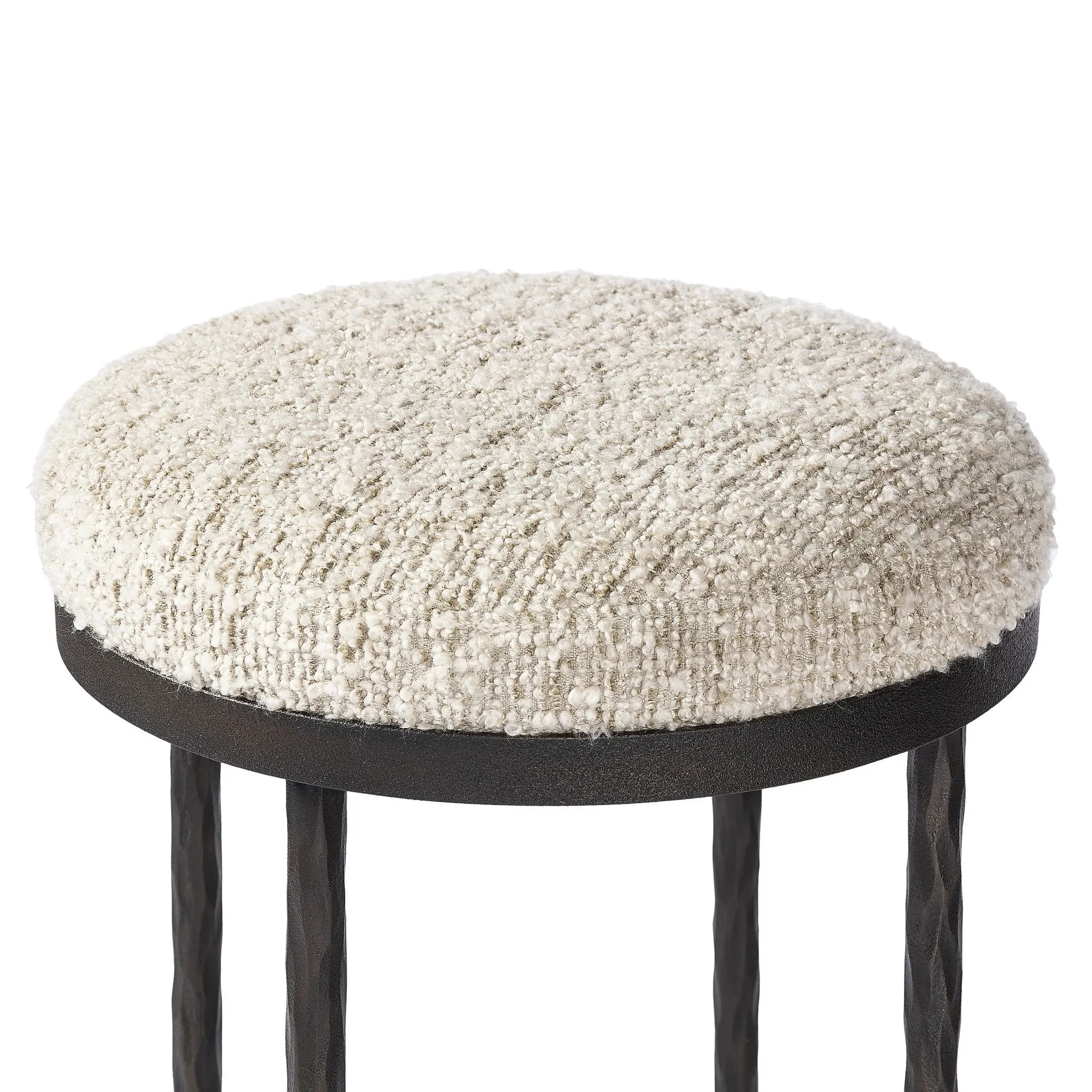 Featuring Corinne Ivan Stone Bar + Counter Stool by Four Hands at Amethyst Home. Hammered bronze legs with ball-shaped foot details elevate this simply shaped counter stool. A round, cushioned seat in a heavy boucle-like fabric finishes this counter-height stool's clean, inviting look.BarOverall Dimensions: 17.00"w x 17.00"d x 31.25"hWeight: 32.19 lbsCounte. Amethyst Home provides interior design, new home construction design consulting, vintage area rugs, and lighting in the Calabasas metro area.