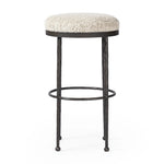 Featuring Corinne Ivan Stone Bar + Counter Stool by Four Hands at Amethyst Home. Hammered bronze legs with ball-shaped foot details elevate this simply shaped counter stool. A round, cushioned seat in a heavy boucle-like fabric finishes this counter-height stool's clean, inviting look.BarOverall Dimensions: 17.00"w x 17.00"d x 31.25"hWeight: 32.19 lbsCounte. Amethyst Home provides interior design, new home construction design consulting, vintage area rugs, and lighting in the Charlotte metro area.
