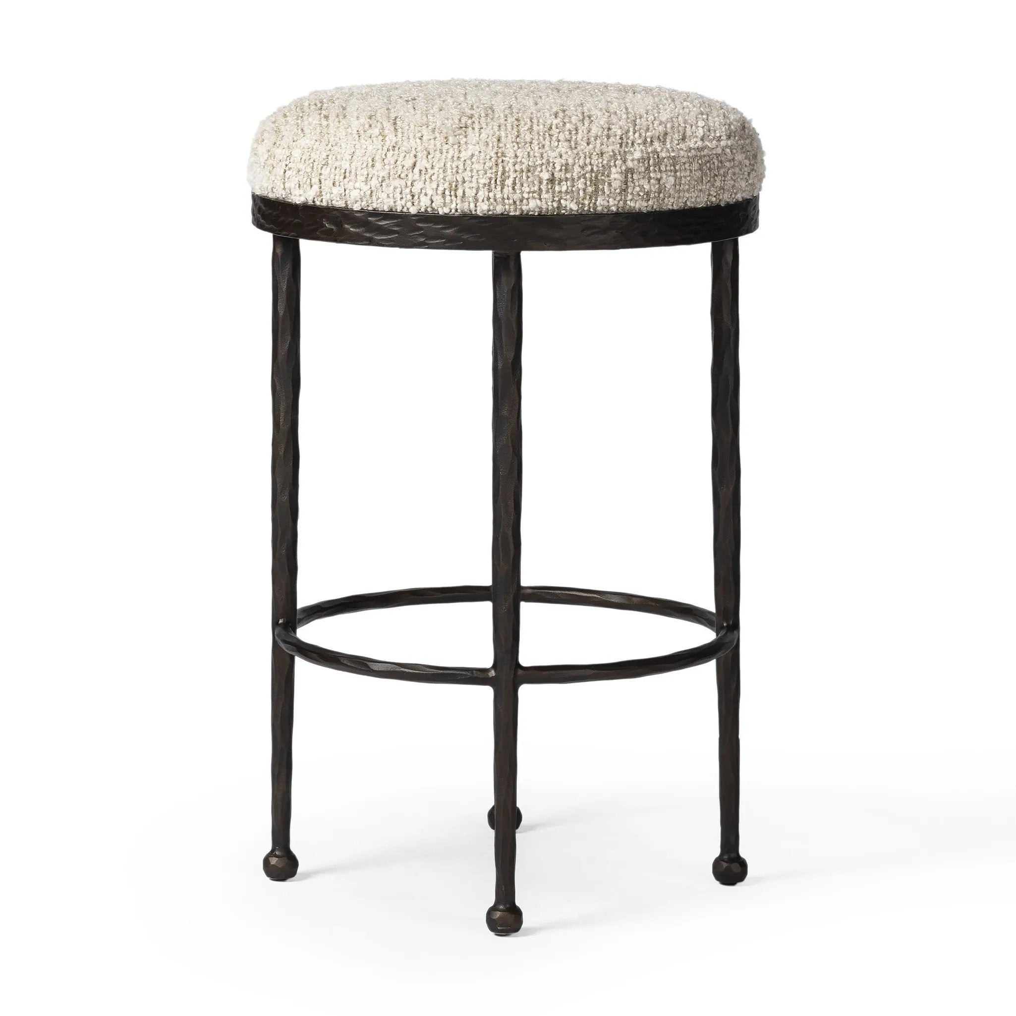 Hammered bronze legs with ball-shaped foot details elevate this simply shaped counter stool. A round, cushioned seat in a heavy boucle-like fabric finishes this counter-height stool's clean, inviting look Amethyst Home provides interior design, new home construction design consulting, vintage area rugs, and lighting in the Laguna Beach metro area.