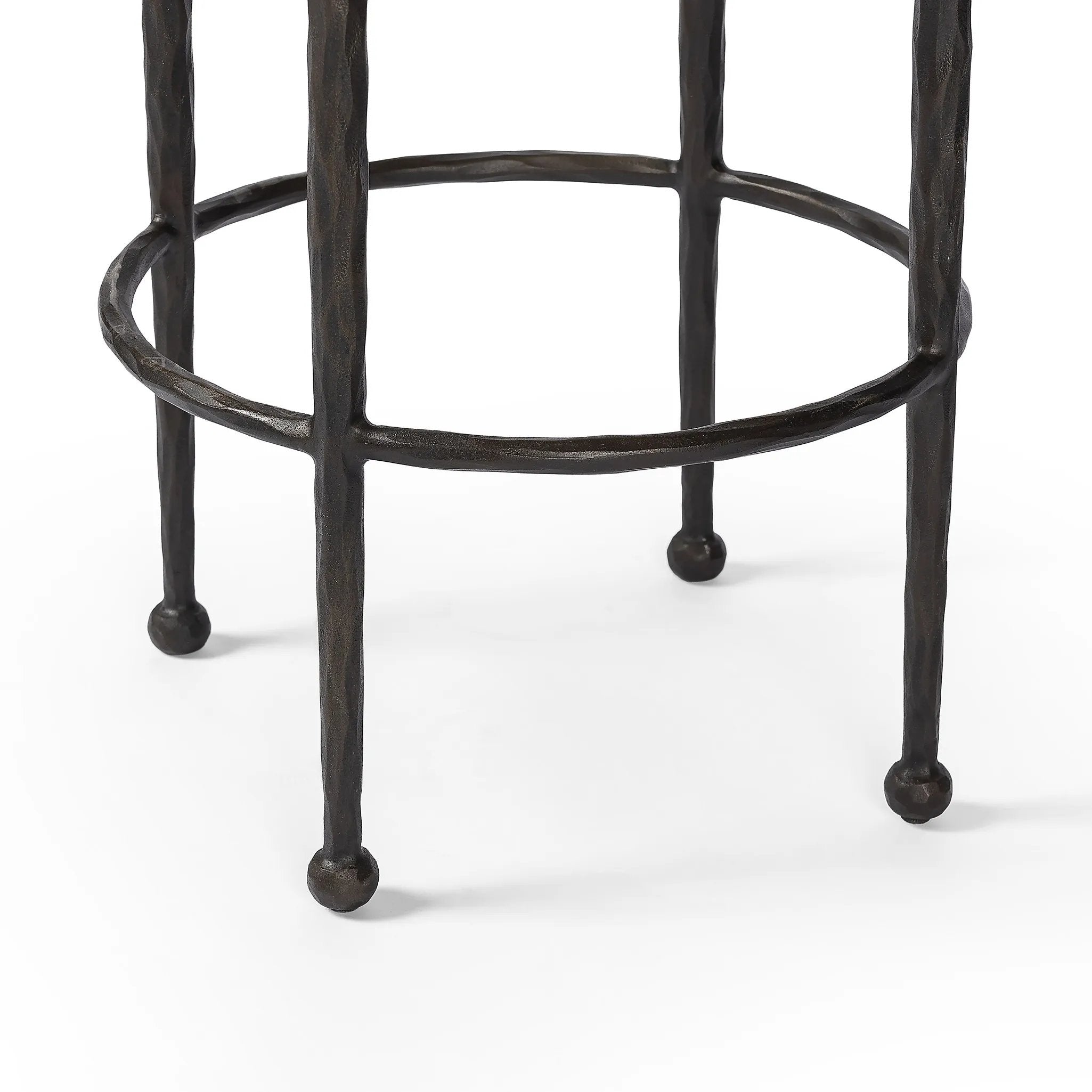 Featuring Corinne Ivan Stone Bar + Counter Stool by Four Hands at Amethyst Home. Hammered bronze legs with ball-shaped foot details elevate this simply shaped counter stool. A round, cushioned seat in a heavy boucle-like fabric finishes this counter-height stool's clean, inviting look.BarOverall Dimensions: 17.00"w x 17.00"d x 31.25"hWeight: 32.19 lbsCounter. Amethyst Home provides interior design, new home construction design consulting, vintage area rugs, and lighting in the Portland metro area.