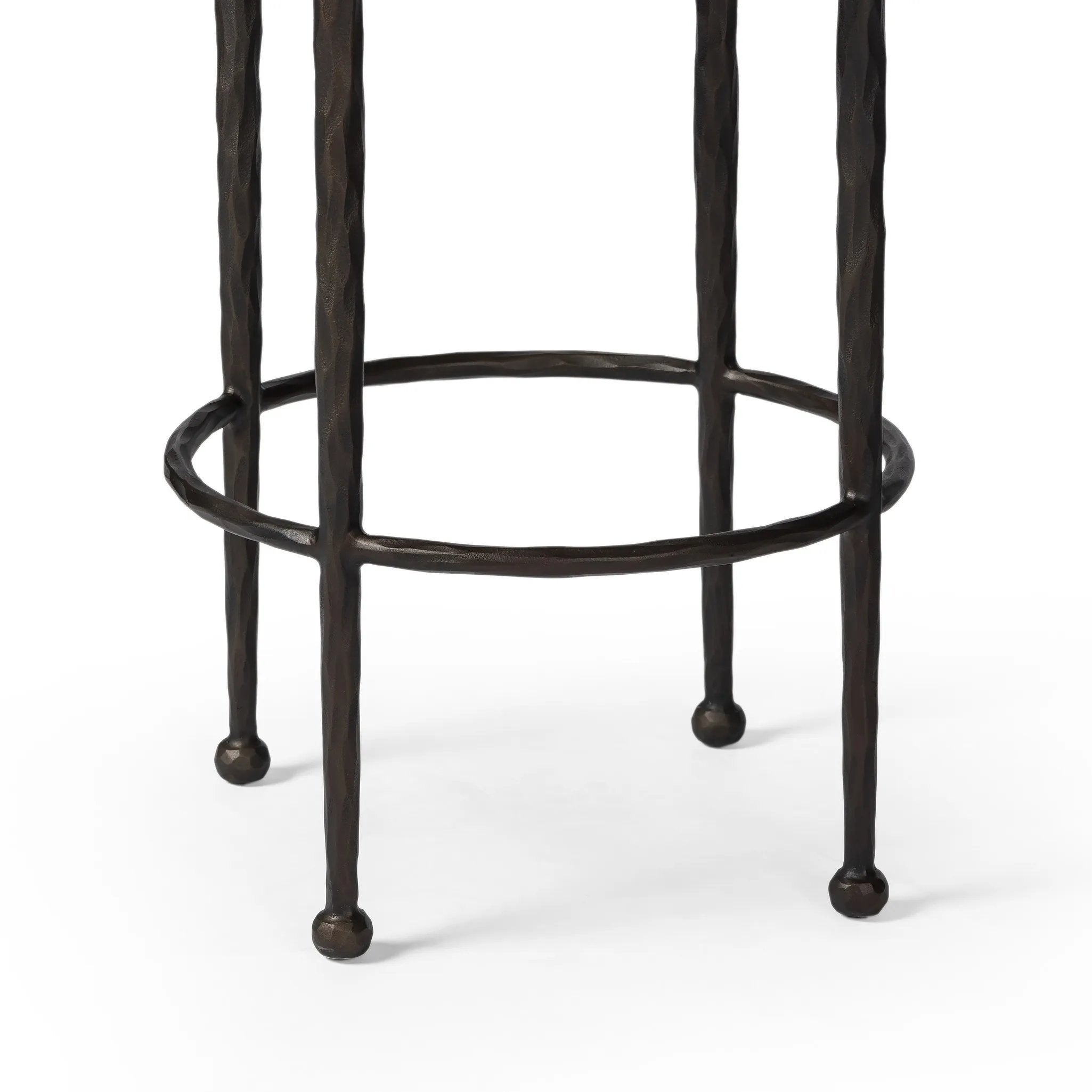 Featuring Corinne Ivan Stone Bar + Counter Stool by Four Hands at Amethyst Home. Hammered bronze legs with ball-shaped foot details elevate this simply shaped counter stool. A round, cushioned seat in a heavy boucle-like fabric finishes this counter-height stool's clean, inviting look.BarOverall Dimensions: 17.00"w x 17.00"d x 31.25"hWeight: 32.19 lbsCounte. Amethyst Home provides interior design, new home construction design consulting, vintage area rugs, and lighting in the San Diego metro area.