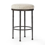 Featuring Corinne Ivan Stone Bar + Counter Stool by Four Hands at Amethyst Home. Hammered bronze legs with ball-shaped foot details elevate this simply shaped counter stool. A round, cushioned seat in a heavy boucle-like fabric finishes this counter-height stool's clean, inviting look.BarOverall Dimensions: 17.00"w x 17.00"d x 31.25"hWeight: 32.19 lbsCounterO. Amethyst Home provides interior design, new home construction design consulting, vintage area rugs, and lighting in the Seattle metro area.