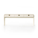 Talk about novelty. Made from painted linen in a light ivory, arched legs soften otherwise clean, modern shaping. Three drawers bring bonus storage space to the living or media room, while half-moon iron hardware adds a hint of art deco style Amethyst Home provides interior design, new home construction design consulting, vintage area rugs, and lighting in the Boston metro area.