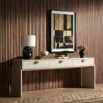 Talk about novelty. Made from painted linen in a light ivory, arched legs soften otherwise clean, modern shaping. Three drawers bring bonus storage space to the living or media room, while half-moon iron hardware adds a hint of art deco style Amethyst Home provides interior design, new home construction design consulting, vintage area rugs, and lighting in the Kansas City metro area.