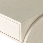 Talk about novelty. Made from painted linen in a light ivory, arched legs soften otherwise clean, modern shaping. Three drawers bring bonus storage space to the living or media room, while half-moon iron hardware adds a hint of art deco style Amethyst Home provides interior design, new home construction design consulting, vintage area rugs, and lighting in the Newport Beach metro area.