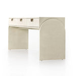 Talk about novelty. Made from painted linen in a light ivory, arched legs soften otherwise clean, modern shaping. Three drawers bring bonus storage space to the living or media room, while half-moon iron hardware adds a hint of art deco style Amethyst Home provides interior design, new home construction design consulting, vintage area rugs, and lighting in the Omaha metro area.