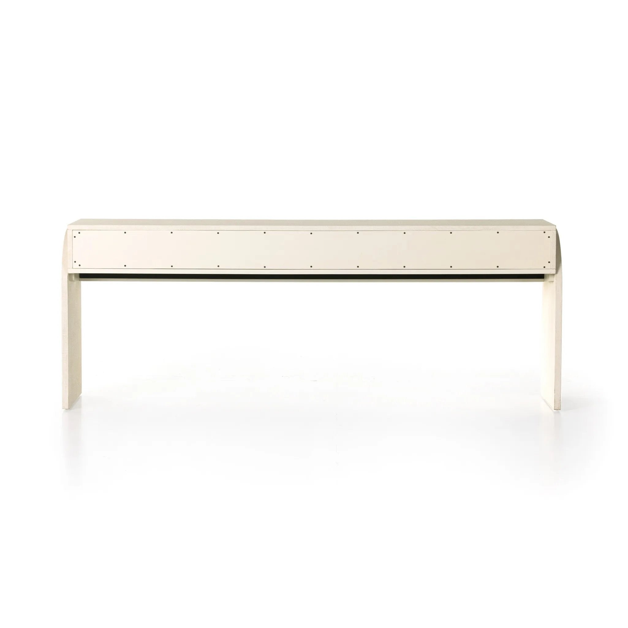 Talk about novelty. Made from painted linen in a light ivory, arched legs soften otherwise clean, modern shaping. Three drawers bring bonus storage space to the living or media room, while half-moon iron hardware adds a hint of art deco style Amethyst Home provides interior design, new home construction design consulting, vintage area rugs, and lighting in the Park City metro area.