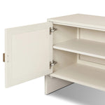 Talk about novelty. Made from painted linen in a light ivory, arched legs soften otherwise clean, modern shaping. Finished in an antique brass, half-moon iron hardware completes this media storage look. Dual rear cutouts for cord management Amethyst Home provides interior design, new home construction design consulting, vintage area rugs, and lighting in the Alpharetta metro area.